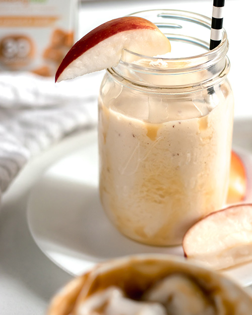 close up of caramel apple smoothie in mason jar