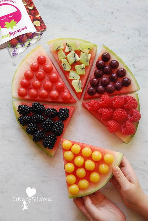 perfectlyfree simple fruit pizza with fruit bites overhead being picked up